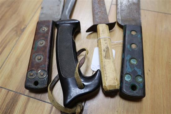 An Islamic tusk handled dagger and three 20th century machetes, longest 60cm